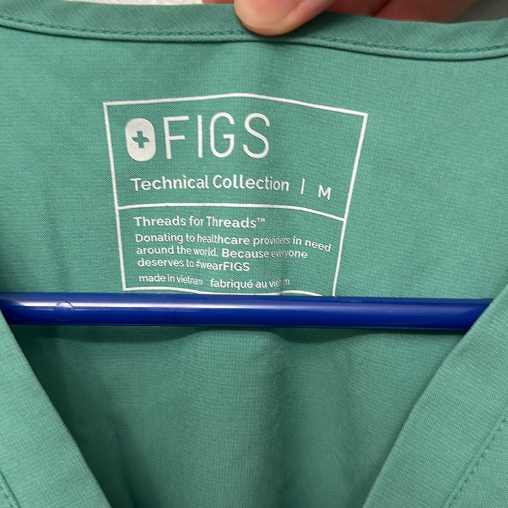Figs blue/green scrubs.